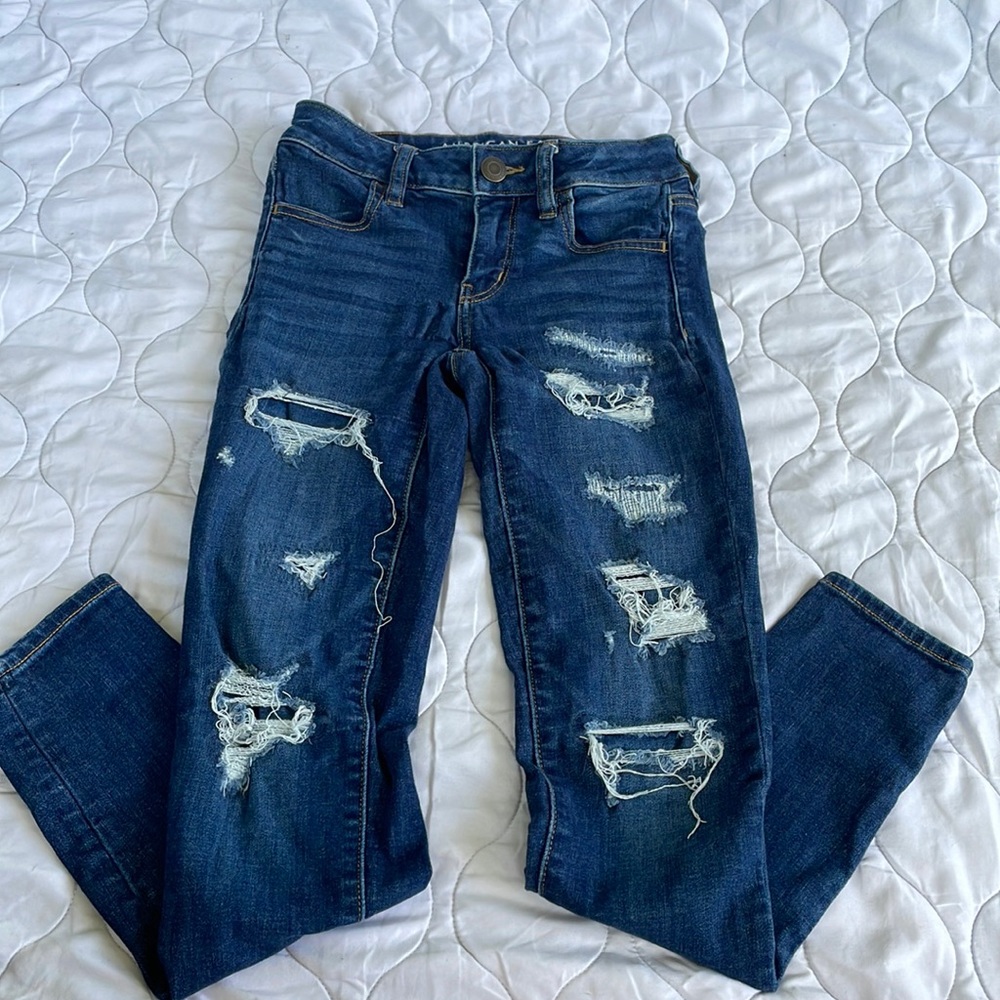 Dark wash jeans with holes